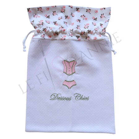 Sac à lingerie blanc, rose et vert anglais, motif fleurs roses sur fond blanc et broderie d'un corset