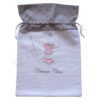 Sac à sous-vêtements dans les tons rose et gris, broderie d'un corset sur le devant et dessous chics